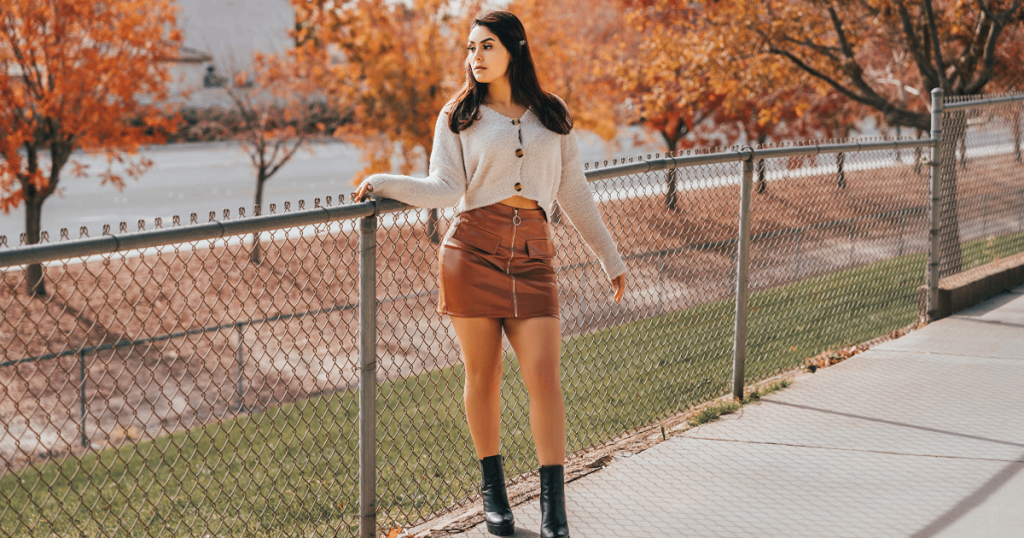 Fall outfit ideas for women USA: layered coat, knit and boots in earthy tones