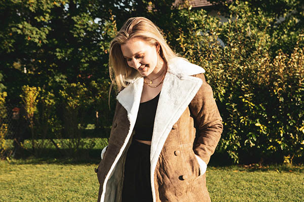 Cream knit set and camel coat — winter brunch outfit ideas USA 2026