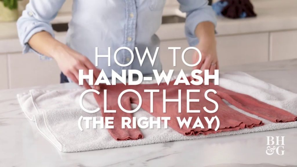 : Gentle hand washing of sustainable linen clothes in a basin