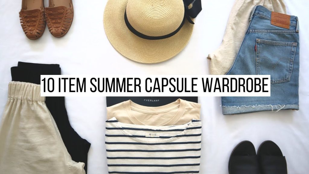 Neatly arranged capsule wardrobe pieces in soft summer shades on white background]