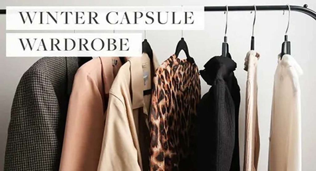 Winter wardrobe essentials checklist on a rack