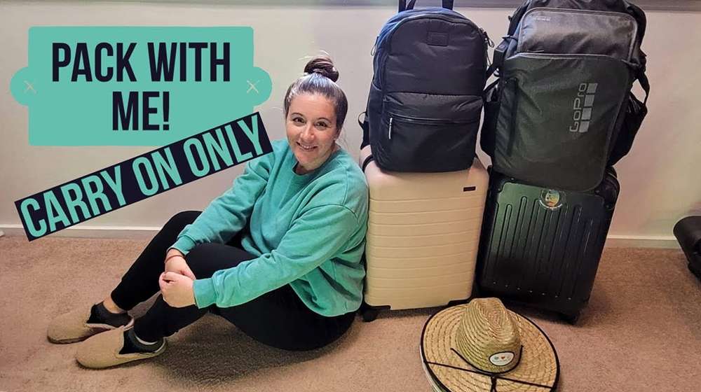 Fall capsule wardrobe packed for travel in a carry on